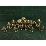 A set of six twin branch brass wall lights.