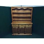 A pine triple door kitchen dresser