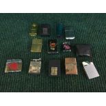 A box of assorted cigarette lighters - Zippo,