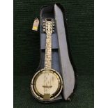 A cased Savannah miniature banjo
