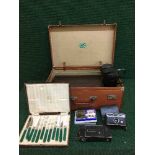 A vintage leather case of dominoes, sewing box, cased cutlery, camera,