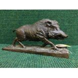 A bronze figure of a boar
