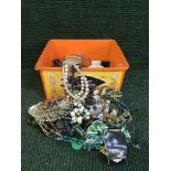 A box of assorted costume jewellery - beaded necklaces,