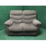 A four piece electric reclining suite upholstered in a brown fabric