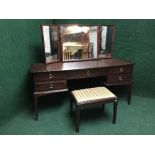 A mahogany stag kneehole dressing table with stool