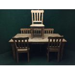 A pine farmhouse dining table fitted a drawer and six chairs