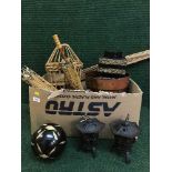 A box and basket of metal tea light holders, oriental resin figures, oriental parasols,