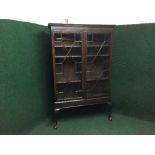 A Victorian style glazed door bookcase