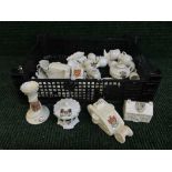 A basket of crested china