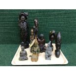 A tray of carved hardwood eastern and tribal figures, pottery figure Japanese warrior,
