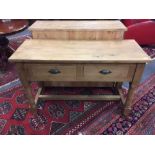 A Victorian style two drawer pine side table