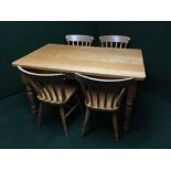 A pine beech topped kitchen table together with four chairs