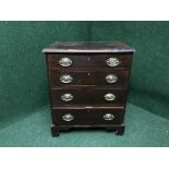 A Victorian inlaid mahogany four drawer chest