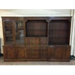 A mahogany Regency style triple section bookcase fitted a bureau