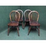A set of four oak windsor style dining chairs