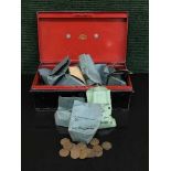 A vintage tin containing a collection of English copper coinage,