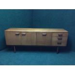 A mid twentieth century teak uniflex cocktail sideboard