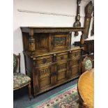 A carved oak buffet sideboard