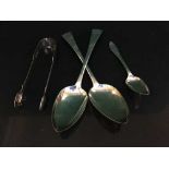 A pair of silver serving spoons,