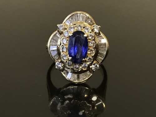 An 18ct gold sapphire and diamond cluster ring,