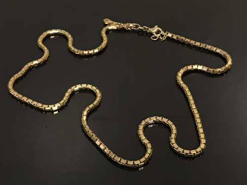 A 9ct gold square watch chain, 27.5g, length 55 cm.