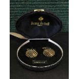 A pair of vintage Norman Hartnell diamond-cut cufflinks, in original box.