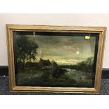 A gilt framed oil on canvas depicting a cottage in marshland indistinctly signed