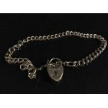 A 9ct gold padlock bracelet, 5.