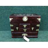 An Oriental style lacquered jewellery casket fitted with drawers,