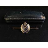 A 9ct gold and enanmel Royal Engineer's bar brooch with emblem, in fitted tooled leather box, 4.