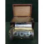 An early twentieth century chrome plated barrel clock, with key, in stained pine box.