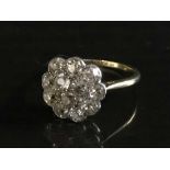 An 18ct gold old cut diamond cluster ring