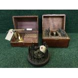 An antique horologist's tap and die set, in mahogany box together with another set similar,