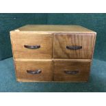 An oak four drawer index chest