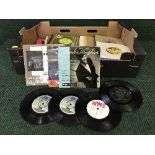 A box of 45's including The Sweet, Simon and Garfunkel,