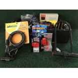 A box of bicycle accessories including halogen head lights, relfectors,