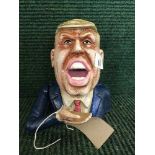 A cast metal money bank - Donald Trump