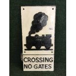 A cast metal plaque - Train level crossing