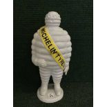 A cast metal figure - Michelin man