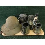 A tray of WW I helmet, plated ware,