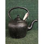 A cast metal kettle