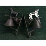 Two cast metal wall brackets with bells (dogs)