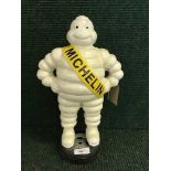 A cast metal figure - Michelin man
