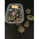 A small collection of military buttons, medal ribbon,