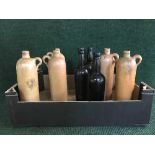 A box of stoneware bottles