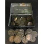 A tin containing a quantity of English coins;