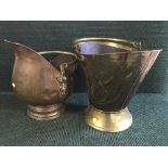 A copper coal bucket and brass coal receiver