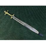 A gilt handled ornamental short sword