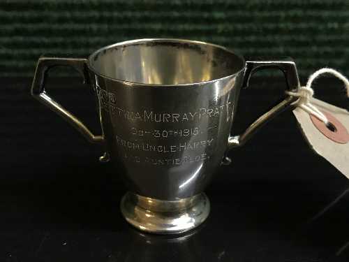 A small Brittania silver twin handled christening mug