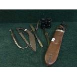 A kukri, a machete in sheath, a Japanese style dagger,